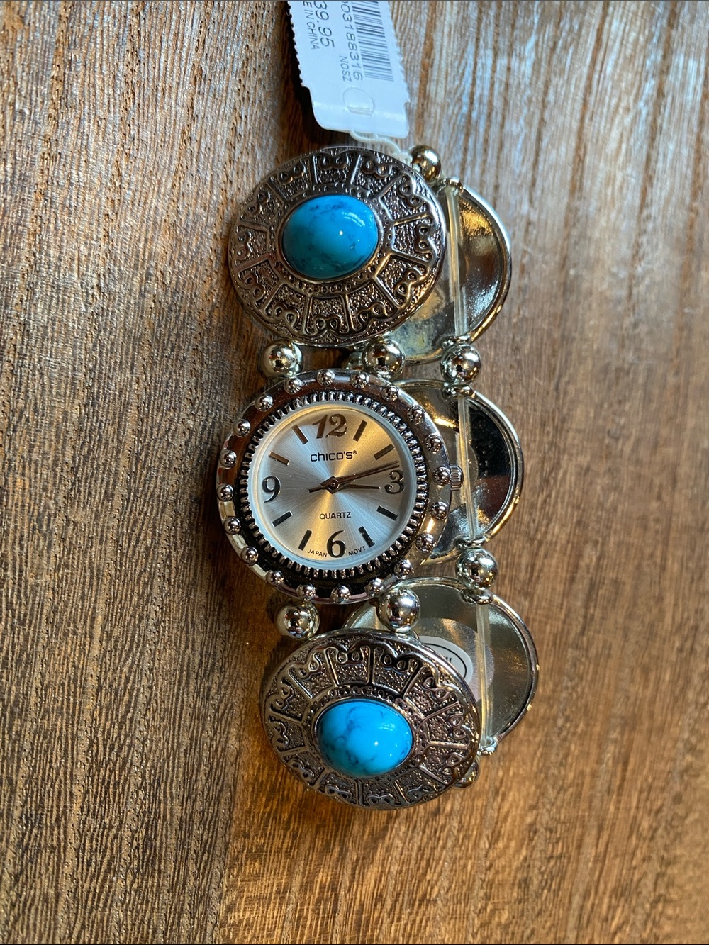New Chico’s silver tone stretchy watch with acrylic turquoise colored cabachons
